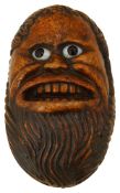 A 19th century treen burrwood snuff box carved as a bearded mans face