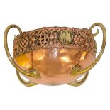 An Arts and Crafts copper and brass jardiniere