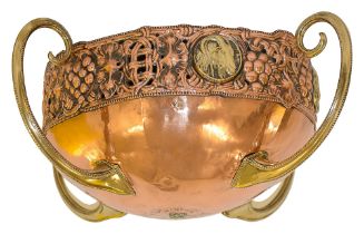 An Arts and Crafts copper and brass jardiniere