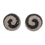 A pair of black and white diamond earrings