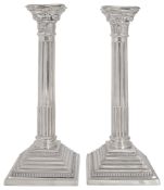 A large pair of Elizabeth II silver Corinthian column candlesticks