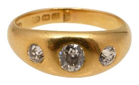 An 18ct yellow gold and diamond three stone ring
