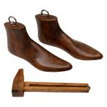 A 19th century boxwood shoemaker's measure with two shoe lasts