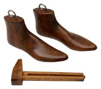 A 19th century boxwood shoemaker's measure with two shoe lasts