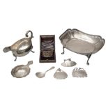 A George V silver dish, gravy boat, napkin ring and five other silver items