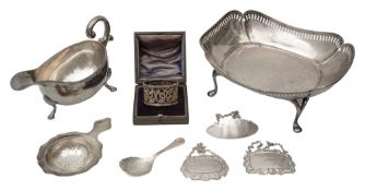 A George V silver dish, gravy boat, napkin ring and five other silver items
