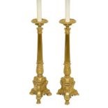 A pair of gilt brass altar candlestick lamps, Baroque style