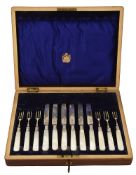An Edwardian cased set of six mother pearl handled fruit knives and forks