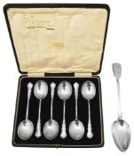 A George V cased set of six silver soup spoons and an early Victorian basting spoon