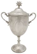 A late Victorian silver twin handled trophy cup and cover