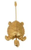 A Chanel pin in the shape of a turtle