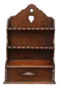 A Victorian style oak spoon rack