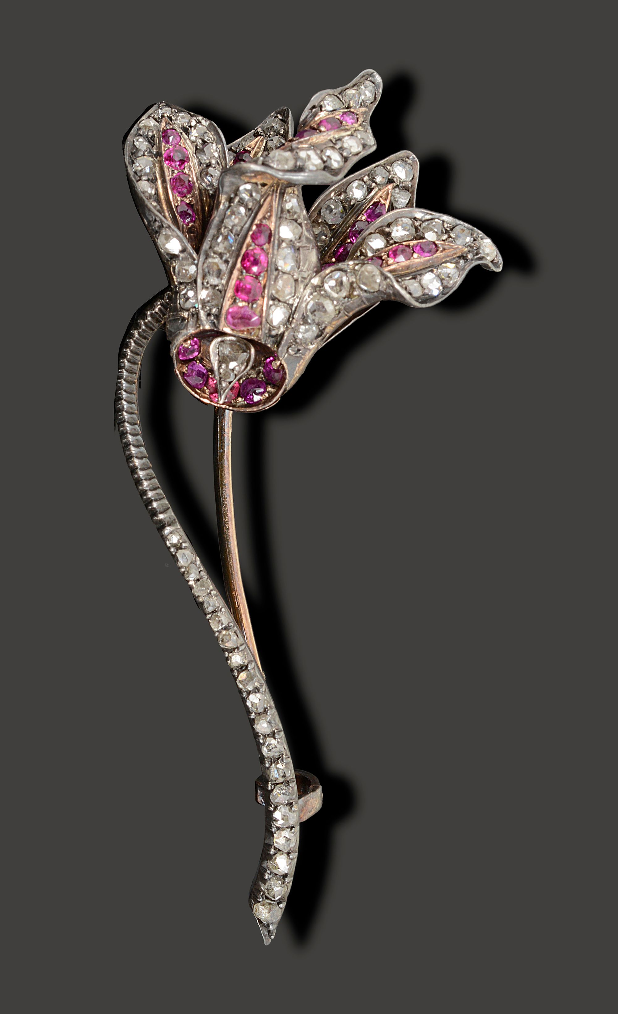 A French late 19th century diamond and ruby-set flower brooch