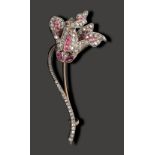 A French late 19th century diamond and ruby-set flower brooch