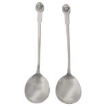 Two George V Arts & Crafts silver preserve spoons