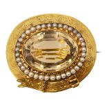 A mid Victorian citrine and half pearl brooch
