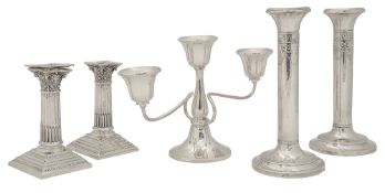 Two pairs of Edwardian candlesticks and a George V candelabrum