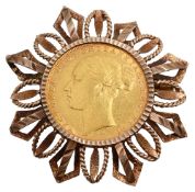 A Victorian gold mounted sovereign brooch