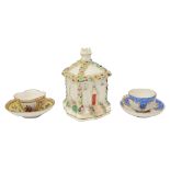 A 19th century Coalport pastille burner and two miniature Dresden cups and saucers