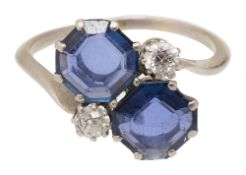 A sapphire and diamond cross-over ring