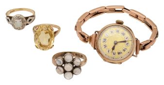 A 9ct gold wristwatch, a 9ct opal ring, a 9ct moonstone ring, and a 9ct citrine ring