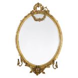 A large Victorian oval giltwood and gesso girandole mirror