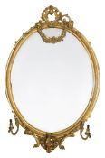 A large Victorian oval giltwood and gesso girandole mirror