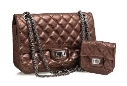 A Chanel bronze quilted 2.55 handbag and purse