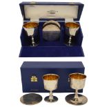 Four Elizabeth II silver commemorative 'York Goblets' and coasters