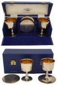 Four Elizabeth II silver commemorative 'York Goblets' and coasters
