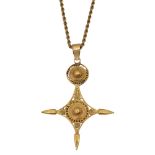 A gold African southern cross pendant