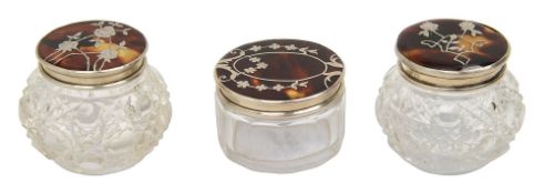 Three silver mounted tortoiseshell and pique inlaid lidded cut glass dressing pots