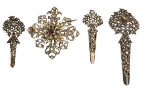 A late 19th century Ceylonese starburst brooch and three turban pins