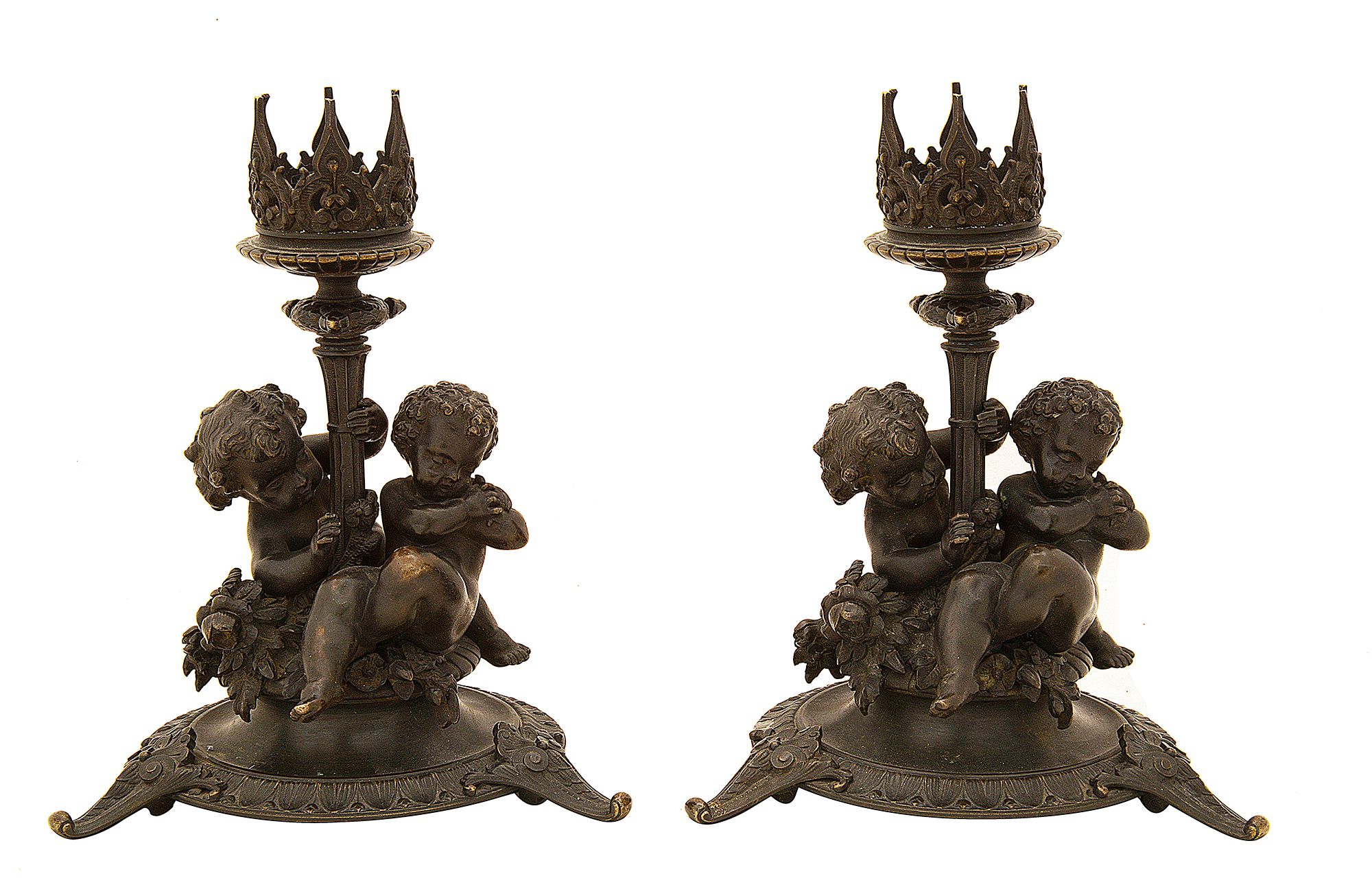 A pair of late 19th century French patinated bronze candlesticks by Fanniere Freres