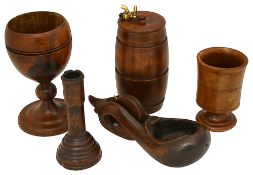 A treen turned oak candlestick, a beechwood string barrel and other items