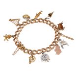 A 15ct curb link charm bracelet with 9ct charms