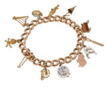 A 15ct curb link charm bracelet with 9ct charms