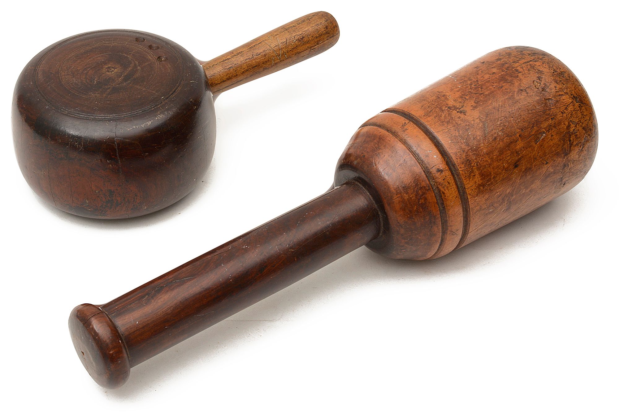 A large 19th century lignum vitae mallet and a lignum saddle maker's mallet