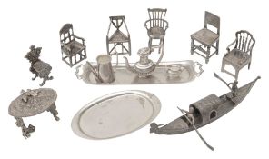 A collection of modern novelty silver miniature armchairs and other novelties