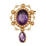 An oval amethyst pendant/brooch