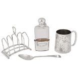 A Vict. silver christening mug and spoon, a toast rack and a silver mounted flask