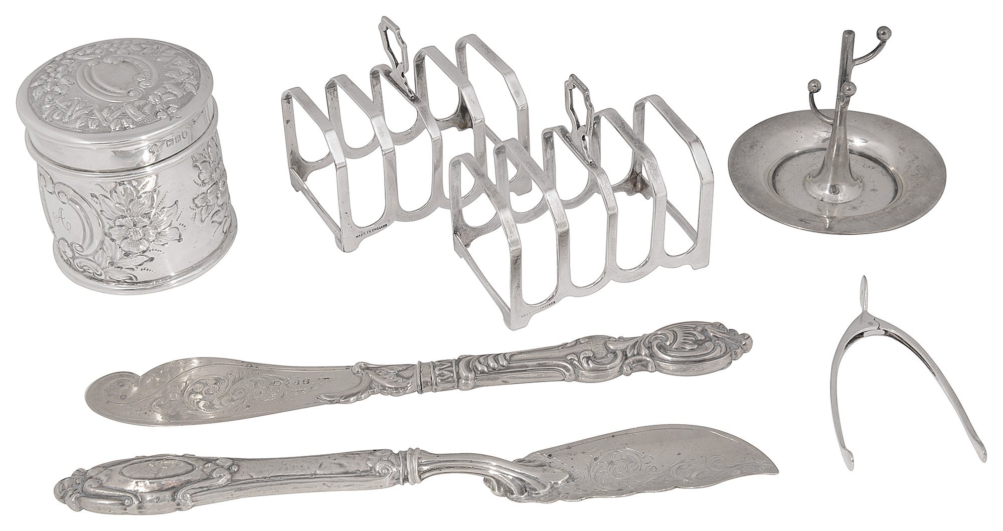 Victorian and later silver to include a lidded pot, pair of toast racks and butter knives