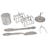 Victorian and later silver to include a lidded pot, pair of toast racks and butter knives