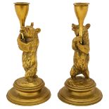 A pair of Victorian brass bear candlesticks