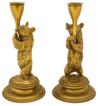 A pair of Victorian brass bear candlesticks