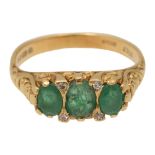 An emerald and 18ct yellow gold ring