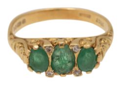 An emerald and 18ct yellow gold ring