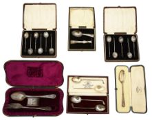 A cased silver christening fork, spoon and napkin ring set, and other silver