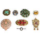 A collection of eight assorted brooches