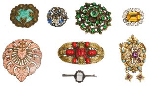 A collection of eight assorted brooches